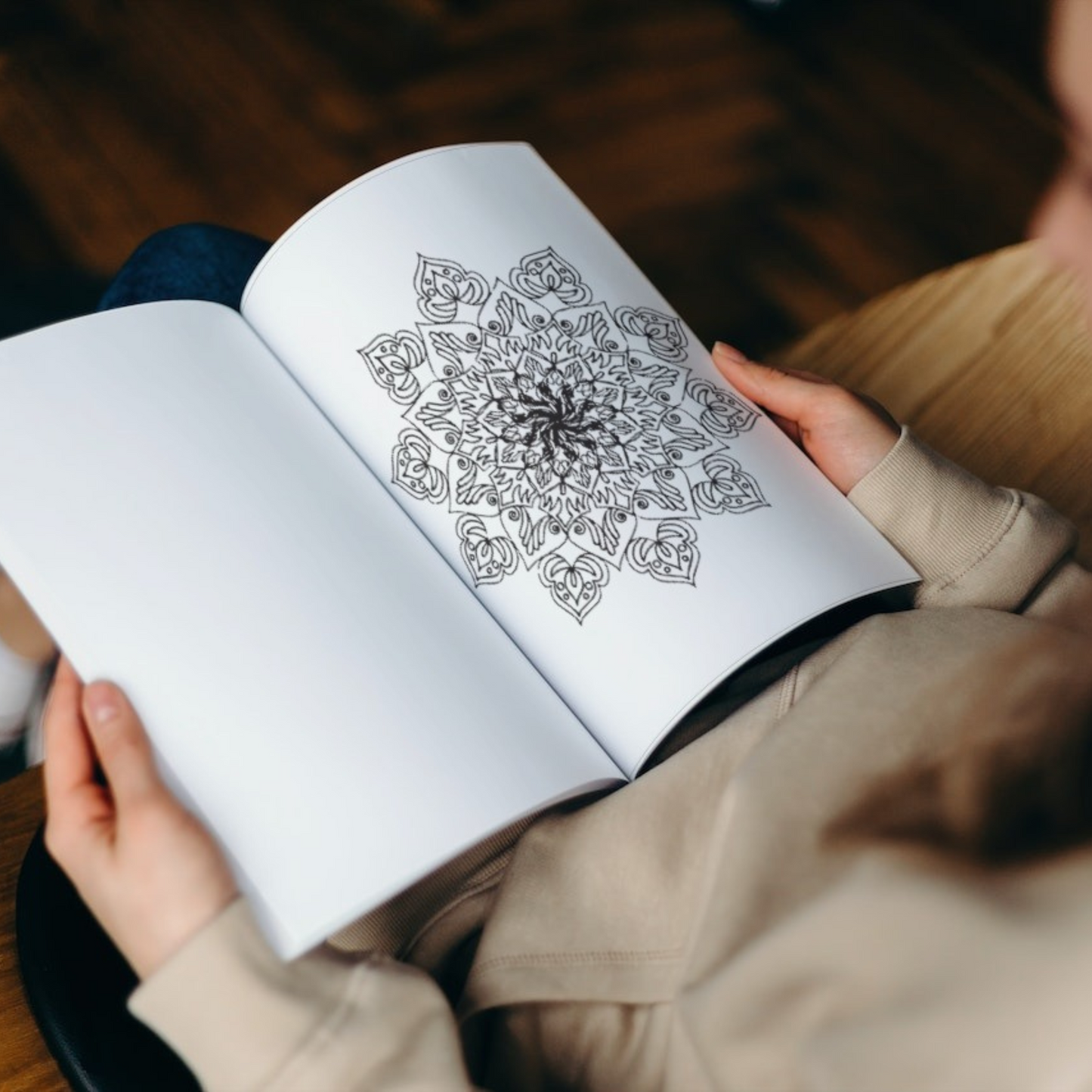 An interior page of "Halloween Mandala Coloring Book for Kids 9-13" by ArisaTeam showing one of the mandalas.