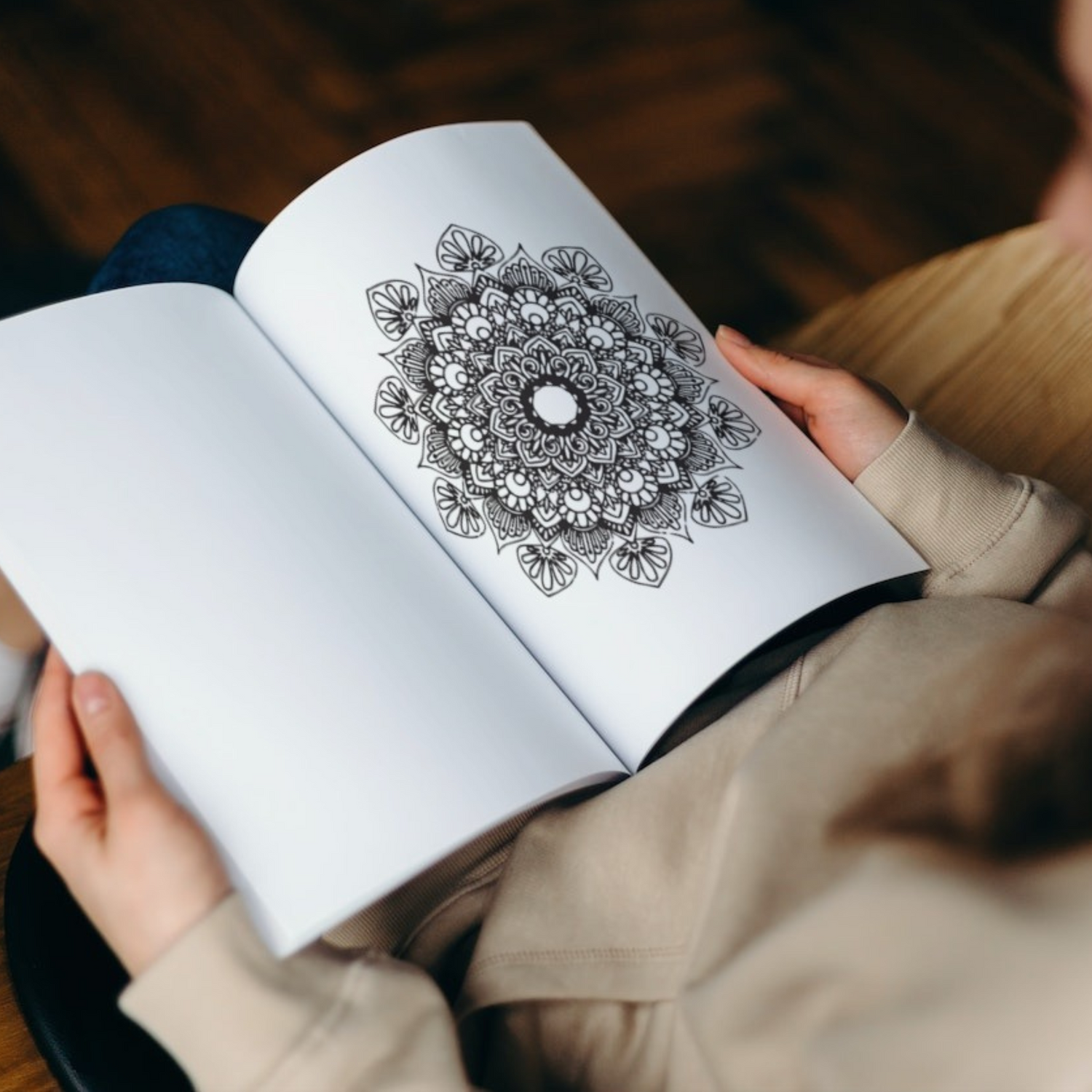 An interior page of "Halloween Mandala Coloring Book for Kids 9-13" by ArisaTeam showing one of the mandalas.