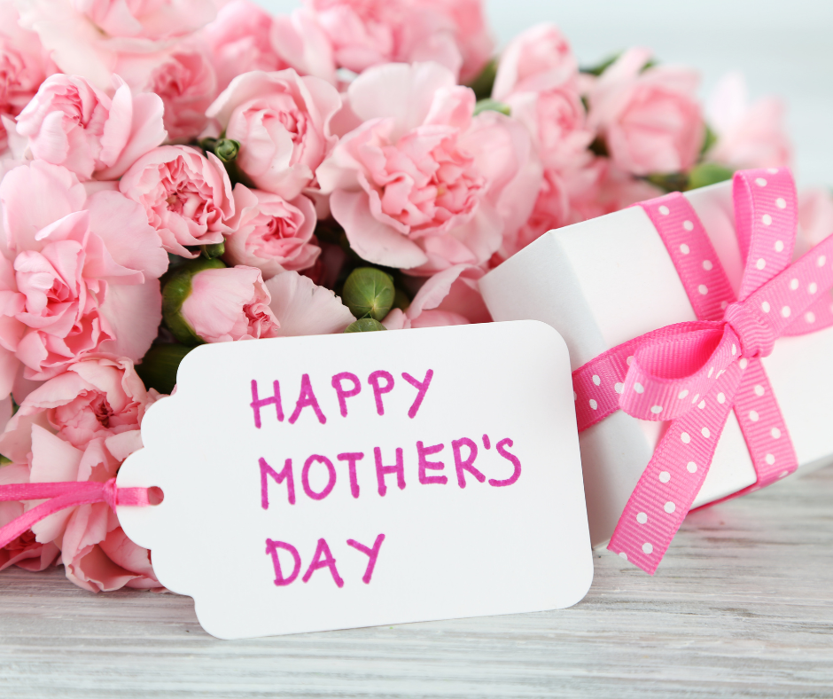 Mother’s Day gift with pink flowers, wrapped present, and “Happy Mother’s Day” card