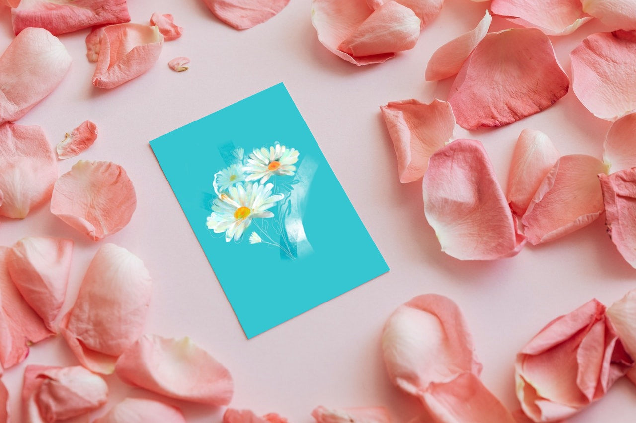 April daisy birth flower greeting card surrounded by pink petals