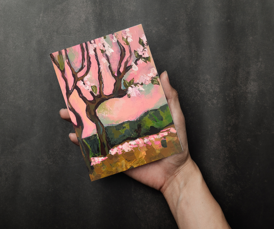 Cherry blossom greeting cards set of 10 with abstract floral artwork held in hand against a dark background