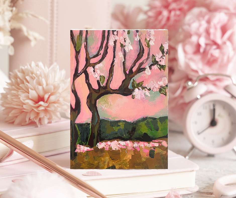 Cherry blossom greeting cards set of 10 with abstract floral artwork displayed on a soft pink desk with flowers and decorative elements