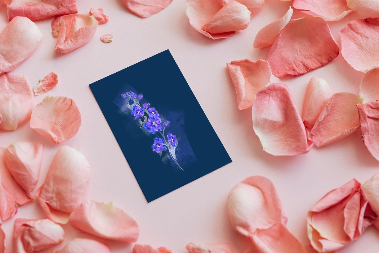 July Larkspur birth flower greeting card surrounded by pink petals