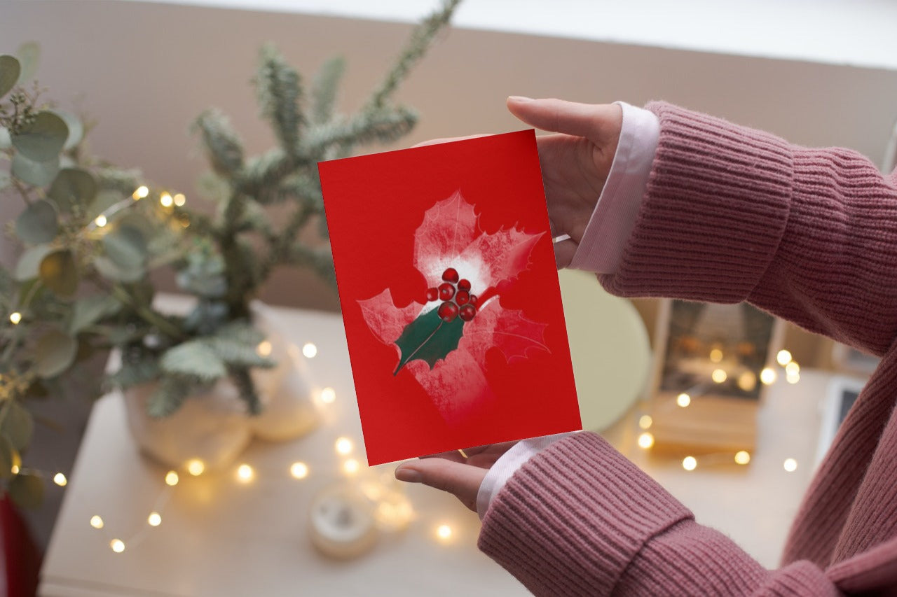 Person holding an October cosmos birth flower greeting card