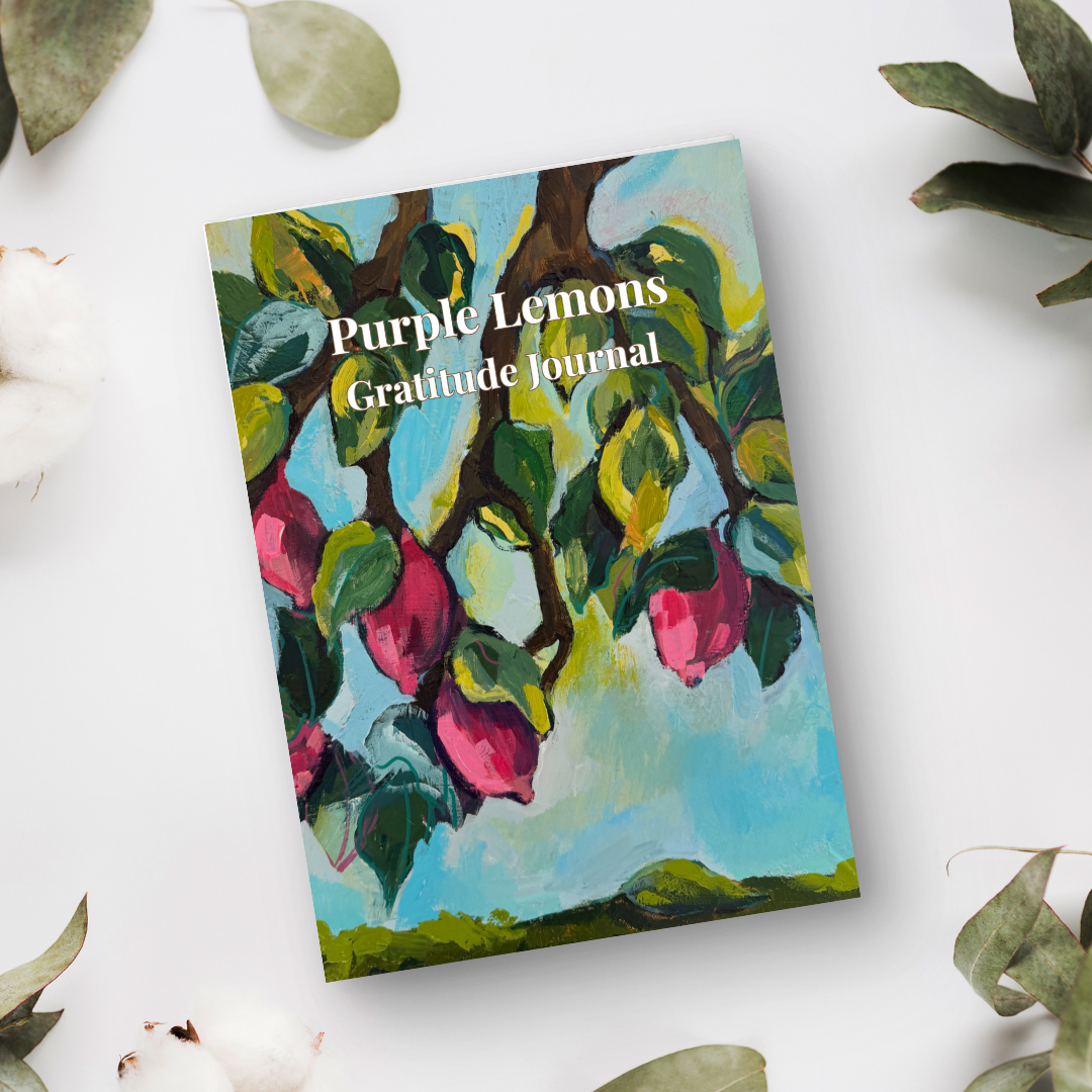 Purple Lemons gratitude journal with colorful lemon tree artwork styled on a light background with natural decor