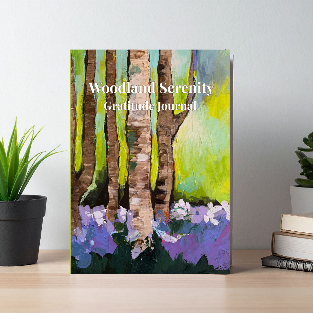 Woodland Serenity gratitude journal with forest-inspired artwork displayed on a desk in a calm, minimalist setting
