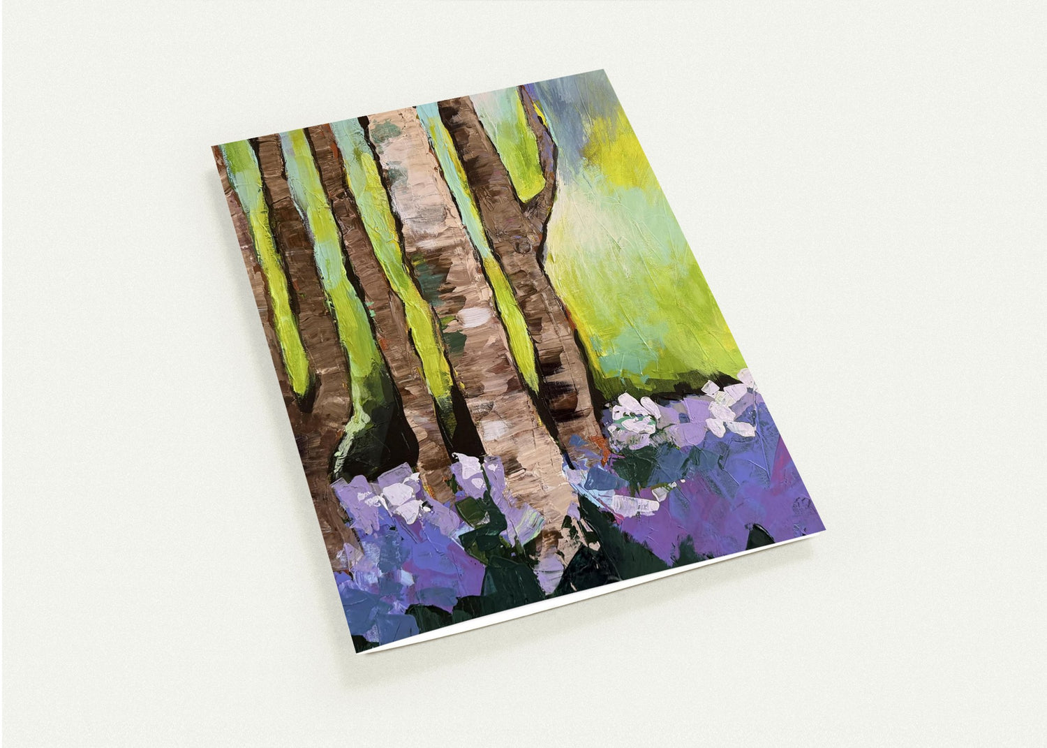 Woodland Serenity greeting card featuring an impressionist forest scene with trees and purple flowers in soft natural tones