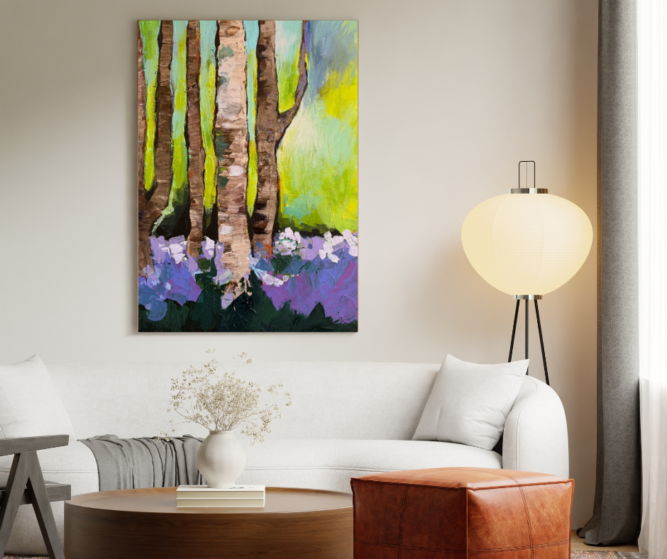 Forest canvas wall art in green and purple tones displayed above a white sofa in a calm modern living room