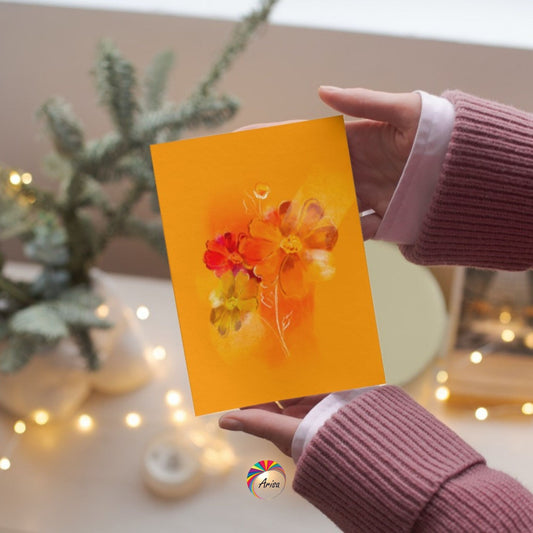 "Cosmos" Greeting Card by ArisaTeam in the hands of a woman and in a Christmas background ideal as a Christmas card.
