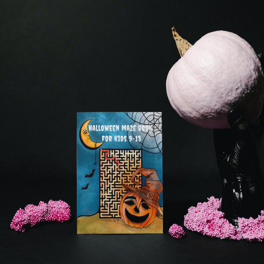 "Halloween Maze Book for Kids 9-13" by ArisaTeam in a set decorated with a white pumpkin and pink small flowers.