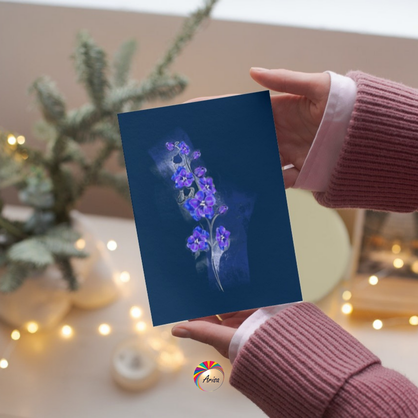 "LARKSPUR" Greeting Card by ArisaTeam in the hands of a woman ideal as a Christmas card.