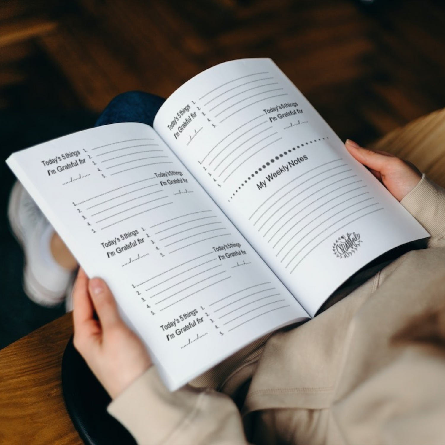 Open Purple Lemons gratitude journal showing daily gratitude prompts and weekly reflection pages for mindful journaling