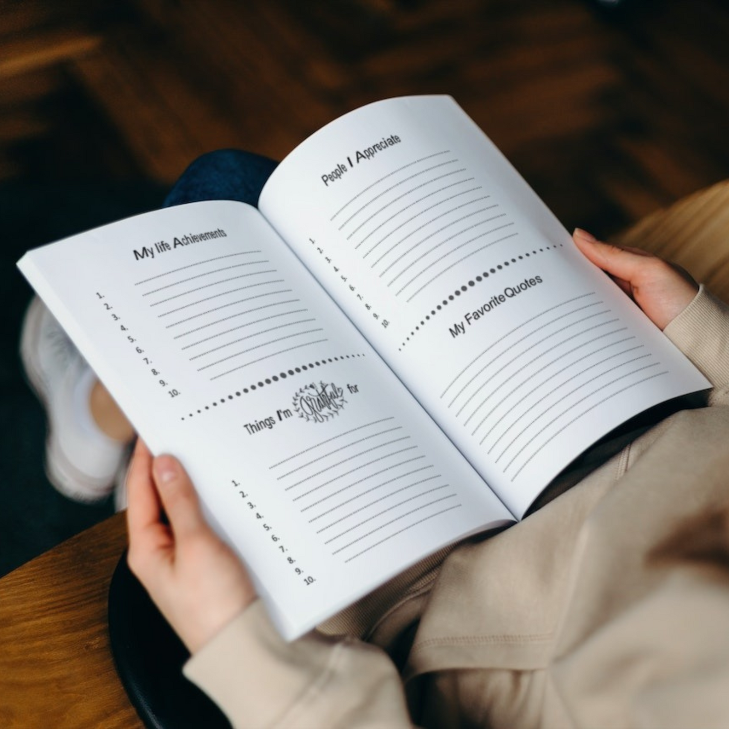 Open Purple Lemons Dream gratitude journal showing guided writing pages for daily reflection and mindfulness in a cozy lifestyle setting